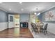 Cozy dining area featuring a round table, stylish lighting, and access to sunroom at 2653 Elkhart Sw Cir, Marietta, GA 30064
