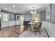 Charming dining room with a round table, wood floors, and natural light at 2653 Elkhart Sw Cir, Marietta, GA 30064