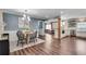Open concept: Dining room with wood floors that flows into a bright updated kitchen at 2653 Elkhart Sw Cir, Marietta, GA 30064