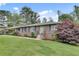 Charming brick home with a well-manicured lawn and mature landscaping at 2653 Elkhart Sw Cir, Marietta, GA 30064