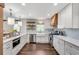 Bright kitchen features white cabinetry, stainless steel appliances, and quartz countertops at 2653 Elkhart Sw Cir, Marietta, GA 30064