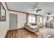 Open-concept living room featuring hardwood floors, a modern sectional, and plenty of natural light at 2653 Elkhart Sw Cir, Marietta, GA 30064
