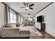 Spacious living room open to kitchen, with hardwood floors, contemporary furnishings, and natural light at 2653 Elkhart Sw Cir, Marietta, GA 30064
