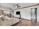 Bright living room flowing into kitchen, with hardwood floors and stylish furnishings at 2653 Elkhart Sw Cir, Marietta, GA 30064