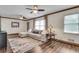 Cozy living room with hardwood floors, a comfortable sectional sofa, and natural light at 2653 Elkhart Sw Cir, Marietta, GA 30064