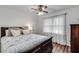 Comfortable bedroom with natural light, plush bedding, and ceiling fan at 2653 Elkhart Sw Cir, Marietta, GA 30064