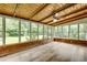 Bright sunroom with floor-to-ceiling windows, wood ceiling, and views of backyard at 2653 Elkhart Sw Cir, Marietta, GA 30064