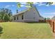 Large fenced backyard with green grass and trees at 3219 Blackshear Dr, Marietta, GA 30060