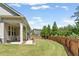 Fenced backyard with a green lawn and a covered patio at 3219 Blackshear Dr, Marietta, GA 30060