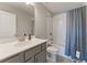 Bathroom with gray vanity, toilet, and tub with shower at 3219 Blackshear Dr, Marietta, GA 30060