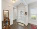 Inviting foyer with hardwood floors, neutral tones, and a view into other living spaces at 3219 Blackshear Dr, Marietta, GA 30060