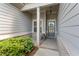Inviting front entrance with a covered porch, decorative wreath, and well-maintained landscaping at 3219 Blackshear Dr, Marietta, GA 30060