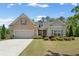 Charming home with a well-maintained lawn, a two-car garage, and a mix of brick and siding exterior at 3219 Blackshear Dr, Marietta, GA 30060