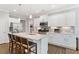 Bright kitchen featuring white cabinets, stainless steel appliances, and a spacious island with bar seating at 3219 Blackshear Dr, Marietta, GA 30060