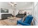 Open-concept living room featuring a ceiling fan and seamless flow into the kitchen, perfect for entertaining at 3219 Blackshear Dr, Marietta, GA 30060