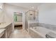 Bright main bathroom with a soaking tub, separate shower, and seamless entry to the bedroom at 3219 Blackshear Dr, Marietta, GA 30060