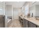 Luxurious main bathroom with dual vanities, quartz countertops, and a glass-enclosed shower at 3219 Blackshear Dr, Marietta, GA 30060