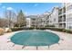 Community outdoor pool covered in tarp at residential apartment complex with balconies at 4100 Paces Se Walk # 2304, Atlanta, GA 30339