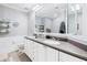 Bathroom featuring a double sink vanity, large mirror, and elegant decor on display shelves at 4100 Paces Se Walk # 2304, Atlanta, GA 30339