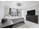 Cozy bedroom with a comfortable bed, dark furniture, and ample natural light from the window at 4100 Paces Se Walk # 2304, Atlanta, GA 30339