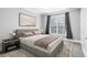 Cozy bedroom featuring neutral tones, a plush bed, and soft lighting near the window at 4100 Paces Se Walk # 2304, Atlanta, GA 30339