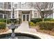 Charming building entrance with a stone walkway, fountain, and well-maintained landscaping at 4100 Paces Se Walk # 2304, Atlanta, GA 30339