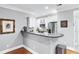 Bright kitchen featuring white cabinetry, stainless steel appliances, and hardwood floors at 4100 Paces Se Walk # 2304, Atlanta, GA 30339
