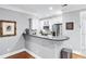 Kitchen with a breakfast bar, stainless steel appliances, and white cabinetry at 4100 Paces Se Walk # 2304, Atlanta, GA 30339