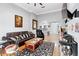 Open concept living room with hardwood floors and views into the kitchen and hallway at 4100 Paces Se Walk # 2304, Atlanta, GA 30339