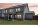 Back exterior view highlighting the covered patio, well-maintained siding, and green backyard at 66 Cottontail Ln, Loganville, GA 30052