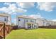Spacious backyard with a well-maintained lawn and a covered patio, perfect for outdoor enjoyment at 66 Cottontail Ln, Loganville, GA 30052