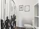 Stylish bathroom featuring a themed shower curtain and modern decor at 66 Cottontail Ln, Loganville, GA 30052