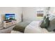 Bright bedroom with a large window view, television and plush pillows at 66 Cottontail Ln, Loganville, GA 30052