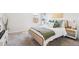 Cozy bedroom with natural light features a plush bed and stylish decor at 66 Cottontail Ln, Loganville, GA 30052