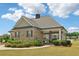 Charming brick clubhouse with outdoor seating and a cupola, perfect for community gatherings and relaxation at 66 Cottontail Ln, Loganville, GA 30052