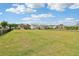 A grassy common area with fence in a neighborhood fosters a sense of community and offers a shared space for relaxation at 66 Cottontail Ln, Loganville, GA 30052