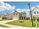 Two-story home with brick and siding exterior, and a manicured front lawn at 66 Cottontail Ln, Loganville, GA 30052