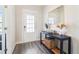Bright foyer featuring stylish floors, a console table, and a decorative mirror at 66 Cottontail Ln, Loganville, GA 30052