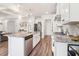Well-equipped kitchen with stainless steel appliances, granite counters, and an island with seating at 66 Cottontail Ln, Loganville, GA 30052