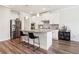 Modern kitchen featuring stainless steel appliances, granite countertops, and a central island with bar seating at 66 Cottontail Ln, Loganville, GA 30052