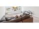 Inviting living room with natural light, a cozy couch, and built-in shelving at 66 Cottontail Ln, Loganville, GA 30052