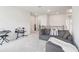 Upstairs loft space with gray sofa and entertainment space at 66 Cottontail Ln, Loganville, GA 30052