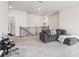 Open concept loft featuring neutral walls and carpet, and stair access at 66 Cottontail Ln, Loganville, GA 30052