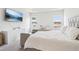 Bright main bedroom showcasing a tray ceiling and ample natural light at 66 Cottontail Ln, Loganville, GA 30052