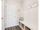 Convenient mudroom entry with built-in bench, storage cubbies, and coat hooks at 66 Cottontail Ln, Loganville, GA 30052