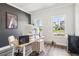 Inviting home office features natural light and stylish minimalist decor at 66 Cottontail Ln, Loganville, GA 30052