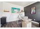 Bright office space with a clean desk, dark accent wall and modern decor at 66 Cottontail Ln, Loganville, GA 30052