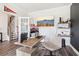 Inviting home office features neutral tones, ample light, and contemporary workspace at 66 Cottontail Ln, Loganville, GA 30052