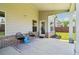 Inviting covered patio with comfortable seating, creating a relaxing outdoor living space at 66 Cottontail Ln, Loganville, GA 30052