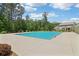 Inviting community pool with mature trees in background, offering a refreshing retreat and a relaxing atmosphere at 66 Cottontail Ln, Loganville, GA 30052